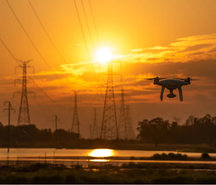 Drone flying in the sunset