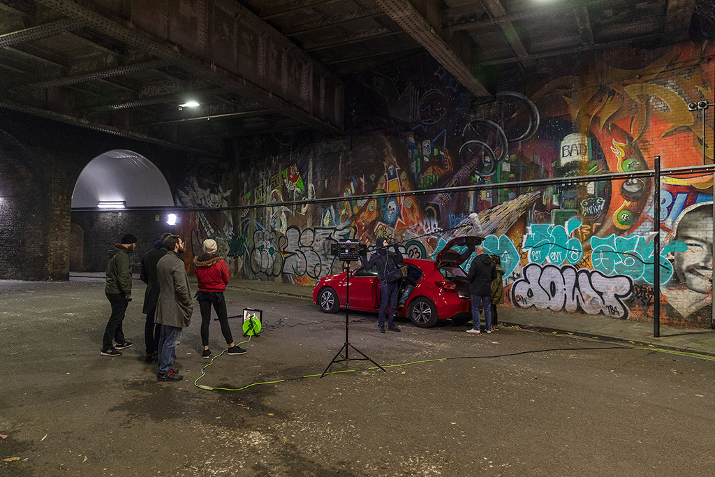 Car in tunnel on film set