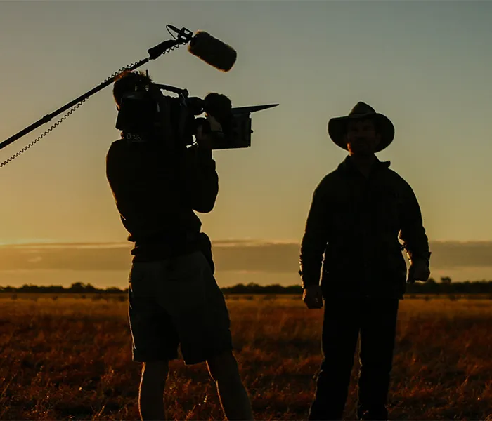 film crew at sunset